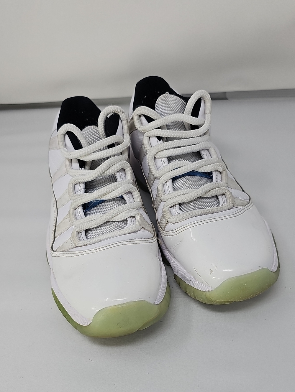 Nike Kids White Sneakers with Black Accents and Glow Green Soles